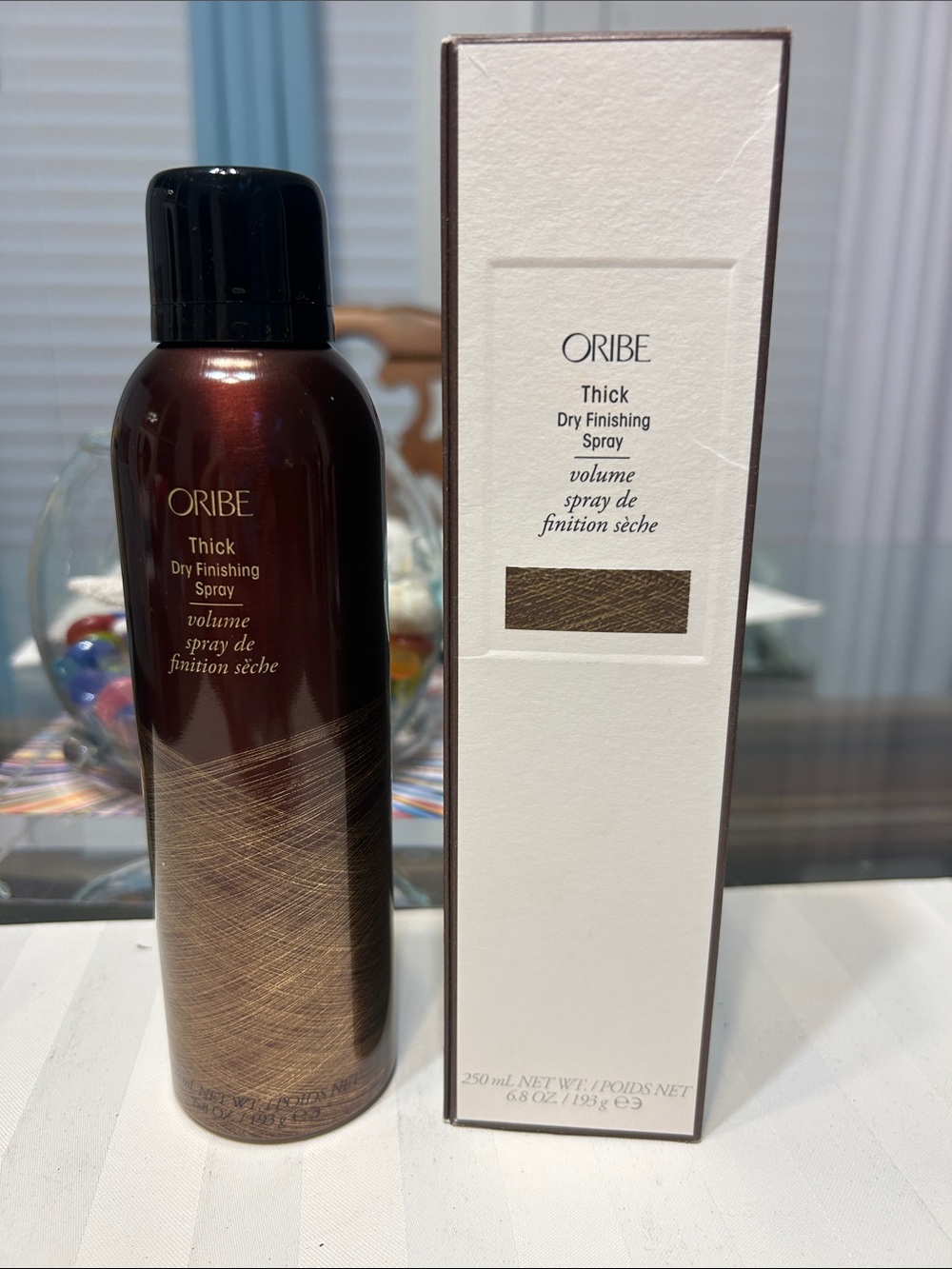 Oribe Thick Dry Finishing Spray — Metallic Brown & Black Bottle
